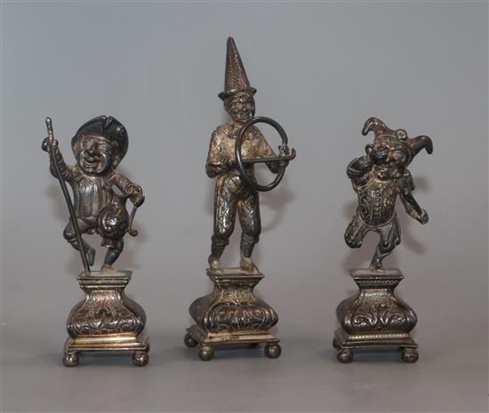 Three late Victorian Hanau? silver miniature figures, jester, harlequin and imbiber, import marks for Louis Landsberg, London